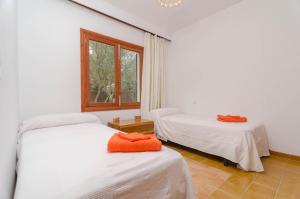 Posteľ alebo postele v izbe v ubytovaní Es Jaç