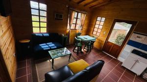 an overhead view of a living room in a log cabin at Glamping Store in Guatavita