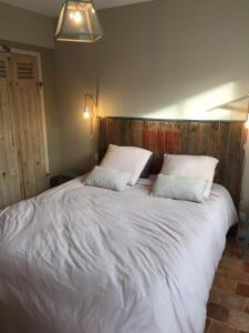 Katil atau katil-katil dalam bilik di Villa La Couarde