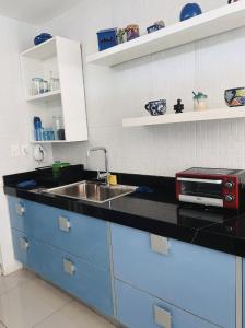 a kitchen with a sink and a counter top at Trade winds International in Progreso +2 photos