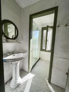 a bathroom with a sink and a mirror at Isla Chaná Private Hideaway in Buenos Aires