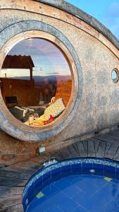 a room with a mirror above a swimming pool at Glampings Magic Bungalow in Villa de Leyva