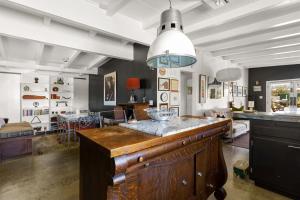 a kitchen and living room with a large island at Cowboy Tubs, Zen Labyinth, Views, Quiet Serenity in Joshua Tree
