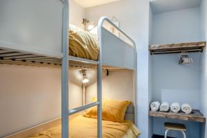 a room with bunk beds in a hostel at 2 Bed in Tenby oc-b41402 in Tenby