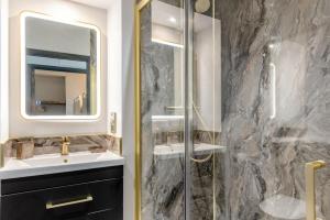 a bathroom with a sink and a shower at 2 Bed in Tenby oc-b41402 in Tenby +16 photos