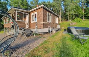 a tiny house with a hot tub in the yard at Pet Friendly Home In Söderköping in Söderköping +31 photos