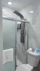 a bathroom with a shower and a toilet in it at Private Miami Suite in Tamiami Airport