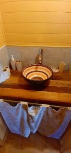 a bathroom with a wooden counter with a sink at Refugio La Lechuza in San Rafael +21 photos