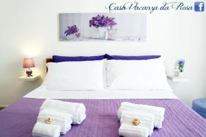 Posteľ alebo postele v izbe v ubytovaní Casa Vacanza da Rosa