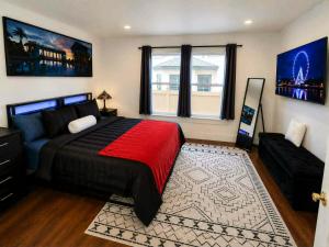 a bedroom with a large bed and a couch at The Victorian House in Buffalo