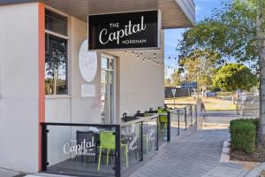 a sign for the carril restaurant on a sidewalk at The Capital Horsham in Horsham +8 photos
