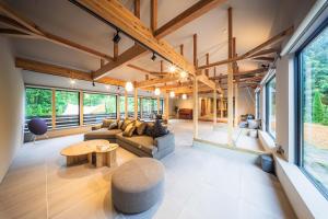 a living room with a couch and a table at Tanglin Maison Hakuba by Jade Villa in Hakuba