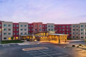 a rendering of the front of a hotel with a parking lot at Residence Inn by Marriott Rapid City in Rapid City