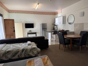 a living room with a couch and a table at The Avalon in Mount Gambier