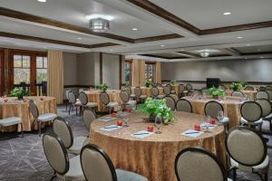 a conference room with tables and chairs in a room at The Ritz-Carlton, Bachelor Gulch in Beaver Creek +140 photos