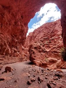 a view of a canyon from inside a cave at Cabañas Rurales HLS in Senador Pérez +13 photos