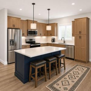 a kitchen with a large island with bar stools at First Tracks Cabin in Eden