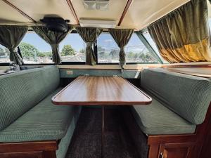 a table in the back of a train car at Buffalo's River Den II - Easy Rider in Buffalo