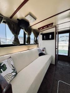 a couch in the back of a van with windows at Buffalo's River Den II - Easy Rider in Buffalo