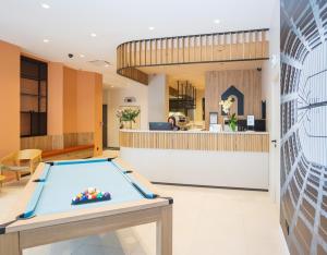a pool table in the lobby of a hotel at Campanile Grenoble Centre Gare in Grenoble