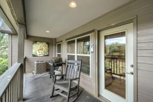 a porch with two chairs and a window at River Pines A303 condo in Edwards