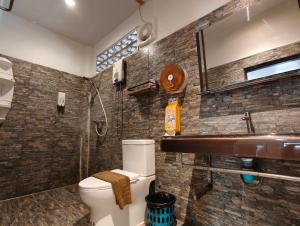a bathroom with a toilet and a sink at Ban Tai Resort in Ban Tai