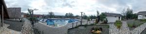 a swimming pool in a yard with a fence at Bregil Villas in Pagudpud +11 photos