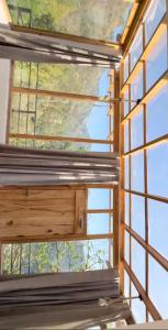 a window in a house with a view of the sky at Nivriti Stays in Nainital