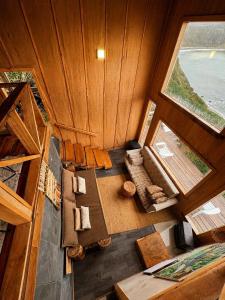 an overhead view of a living room with a window at Pumillahue Lodge cabaña matrimonial in Ancud +14 photos