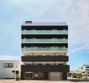 a tall building with a lot of windows at Moat Inside Hakata in Fukuoka +16 photos