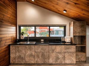 a kitchen with a sink and a window at An Valley Villa Đà Lạt in Da Lat +45 photos