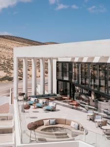 a rendering of a building with chairs and tables at Zel Fuerteventura in Costa Calma