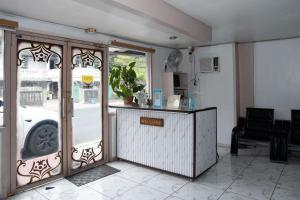 a restaurant with a door open to a car outside at EnPensionne Hotel in Iloilo City