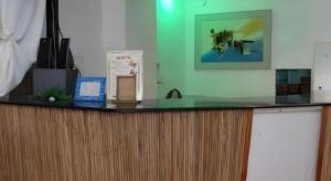 a counter in a room with a green wall at Boracay Breeze Resort in Boracay