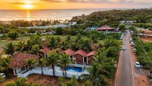 an aerial view of a house with palm trees at Baga beach heritage resort in Calangute