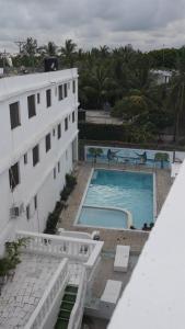 a view of a building and a swimming pool at Havilla Cecilia in Watamu