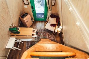 an overhead view of a tiny house with a bed and a desk at Romantic A-Frame Couples Retreat Cozy and 12 Acres in Rockbridge
