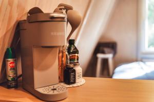 a coffee maker sitting on top of a table at Charming A-Frame Couples Retreat Cozy and Private in Rockbridge