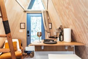 a tiny house with a table and a window at Charming A-Frame Couples Retreat Cozy and Private in Rockbridge