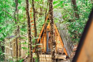 a tree house in the middle of the forest at Charming A-Frame Couples Retreat Cozy and Private in Rockbridge