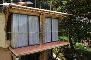 a house with a balcony on top of it at Finca Agualinda in San Francisco