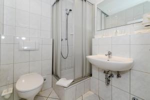Koupelna v ubytování Kurhaus Hotel