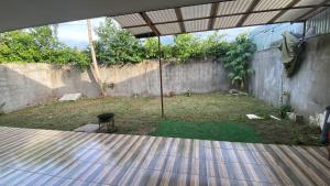 an outside view of a patio with an umbrella at Casa Palo Verde in Bagaces
