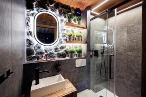 a bathroom with a sink and a shower at Glamping Babákov in Včelákov