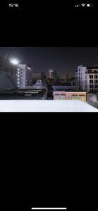 a view of a city at night with buildings at Lumi living hostel in Ho Chi Minh City +9 photos