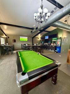 a gaming room with a pool table in it at Dooley's Tavern & Motel Springsure in Springsure