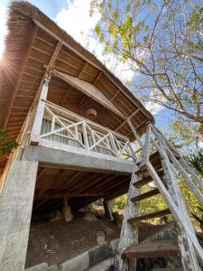 a building with a staircase leading up to it at Lombok eco Lumbung in Gili Gede +11 photos