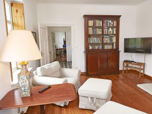 a living room with a couch and a table at Gutshaus Glowitz in Glowitz