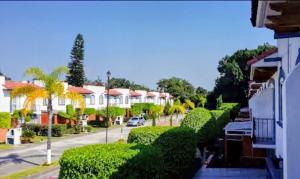 a view of a street with houses and trees at VILLA REAL lll YAUTEPEC in Yautepec de Zaragoza