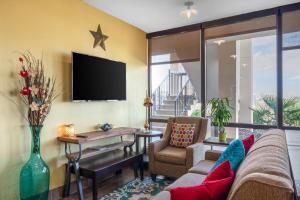 a living room with a couch and a table at Quality Inn West Fort Worth in Fort Worth